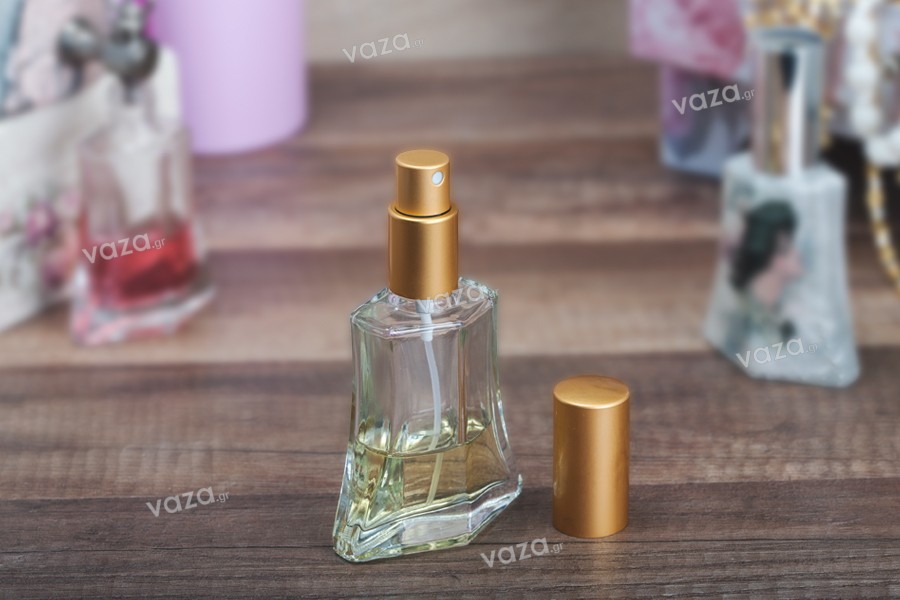 Bottiglia di profumo in vetro trasparente da 50 ml con spray e tappo.